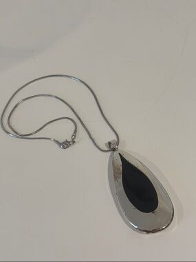 Silver tear drop necklace black inset 16” chain NSD marking on back 1.3oz